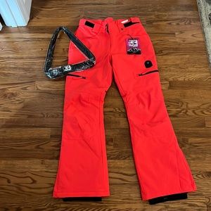 BRAND NEW neon coral women’s lined Rehall ski pants. Size medium.